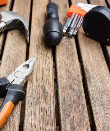 Hand tools on a wooden workbench