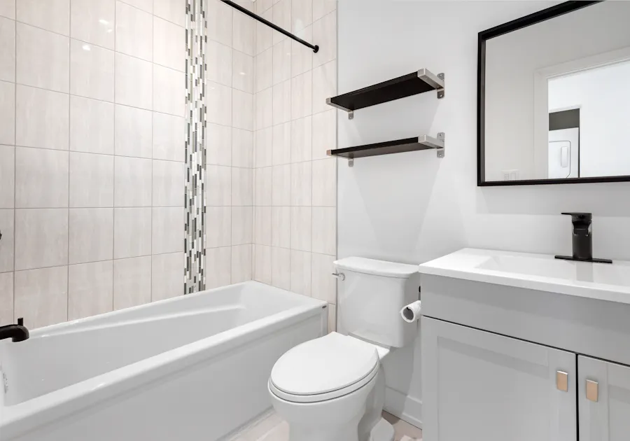 Refinished white bathtub and tile surround